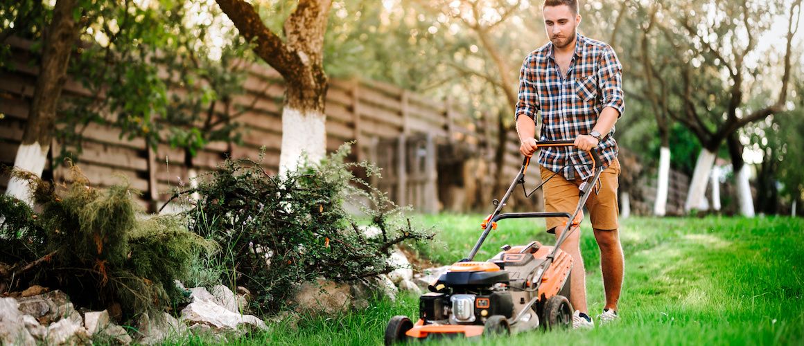 RHB Assets From IGX: Man mowing the lawn in front of a suburban home.