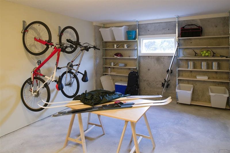 RHB Assets From IGX: An organized storage room in a basement with shelves and labeled containers.