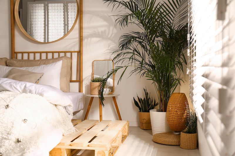 RHB Assets From IGX: Cozy boho-style bedroom with colorful textiles and decor.