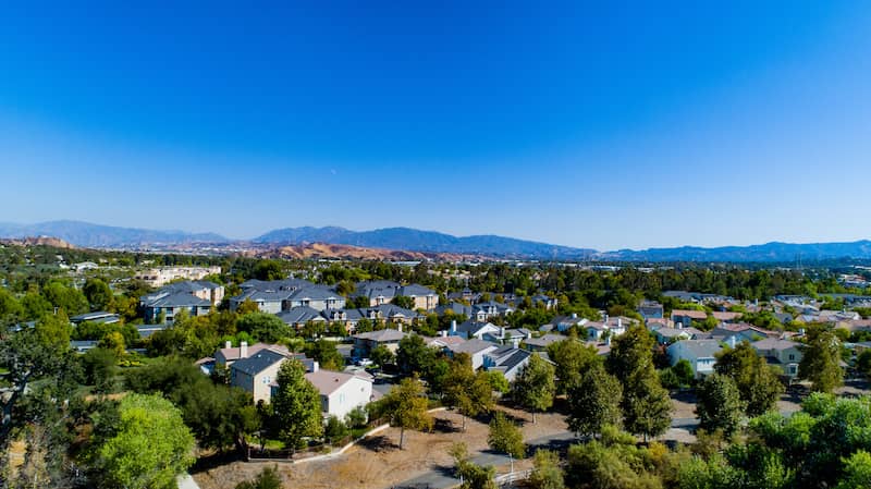 RHB Assets From IGX: Aerial view of Santa Clarita, California, with a mix of residential neighborhoods and commercial areas.