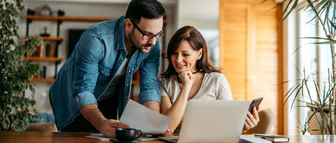 Image of couple reviewing a loan promissory note.