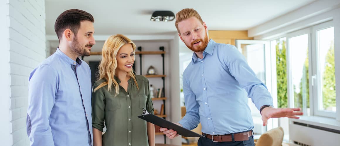 RHB Assets From IGX: A couple with a home appraiser during an inspection.