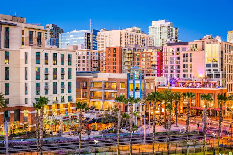 RHB Assets From IGX: Scenic San Diego skyline with harbor and skyscrapers at sunset.