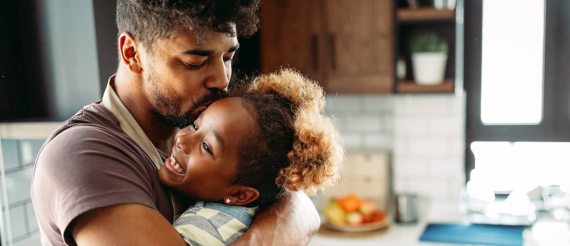 Heartwarming hug between man and child.