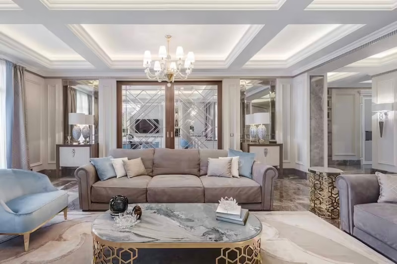 RHB Assets From IGX: Elegant living room with coffered ceiling and chandelier