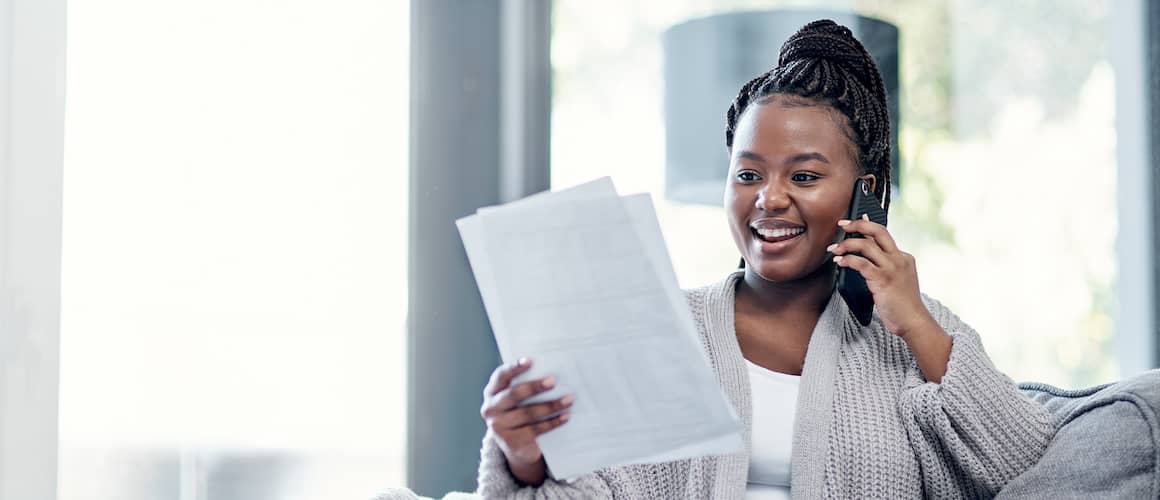 RHB Assets From IGX: Excited African-American woman receiving good news about finances