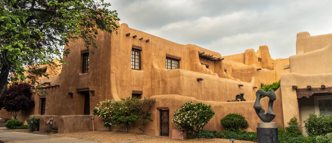 RHB Assets From IGX: Orange adobe Pueblo Revival style house