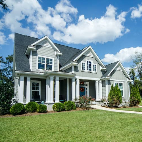 A gray modern cottage home, showcasing modern architectural design.