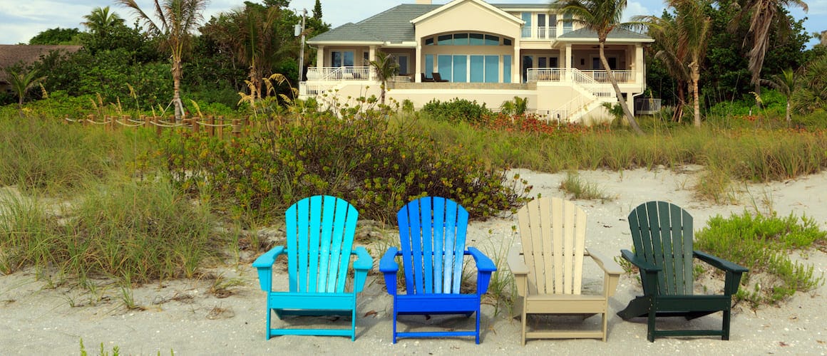 Possibly a beach house with chairs on beach facing the ocean indicating a property intended for investment purposes.