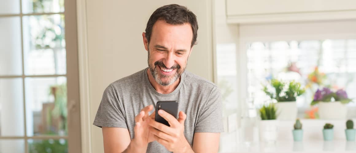 Man on the phone at home, possibly related to communication or home life.