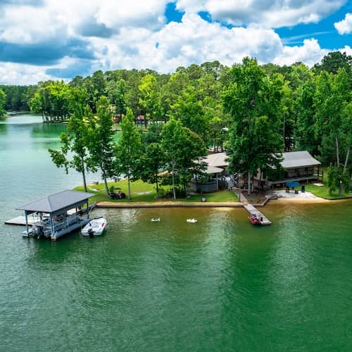 Aerial view of waterfront home with dock on Lake Martin, Alabama.
