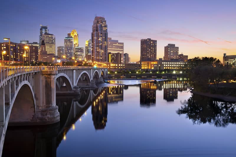 RHB Assets From IGX: Minneapolis skyline reflecting on a lake at dusk