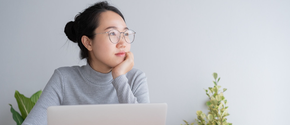 RHB Assets From IGX: Woman working at her home office desk with laptop