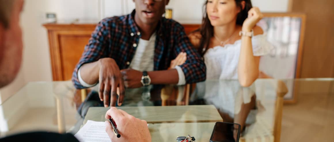 Couple meeting with financial advisor.