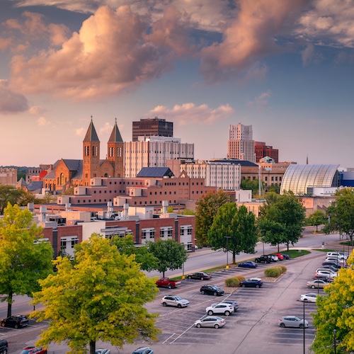 Cityscape of Akron, Ohio with a cloudy sky.