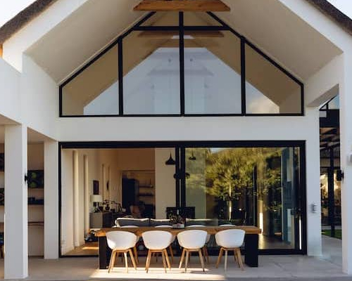 An image portraying a newly built home, highlighting its modern design and clean exterior.
