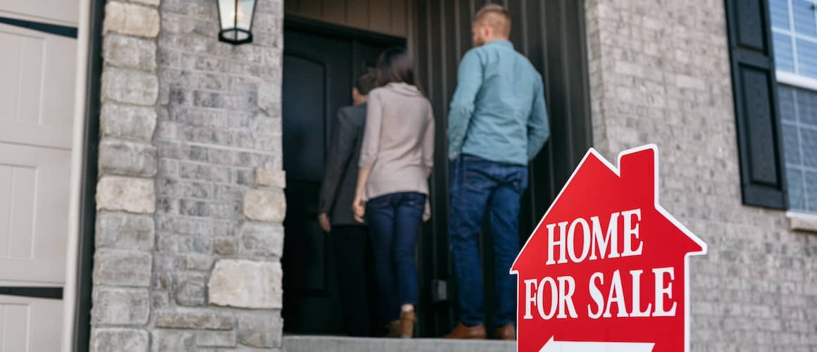 clients walking in with agent and real estate showing