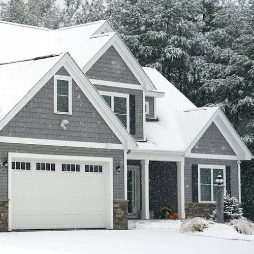 A large house in winter, showcasing a spacious residential property during the winter season.
