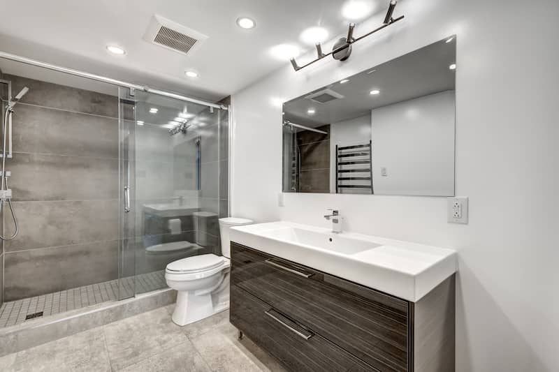 RHB Assets From IGX: Gray and white bathroom with large mirror