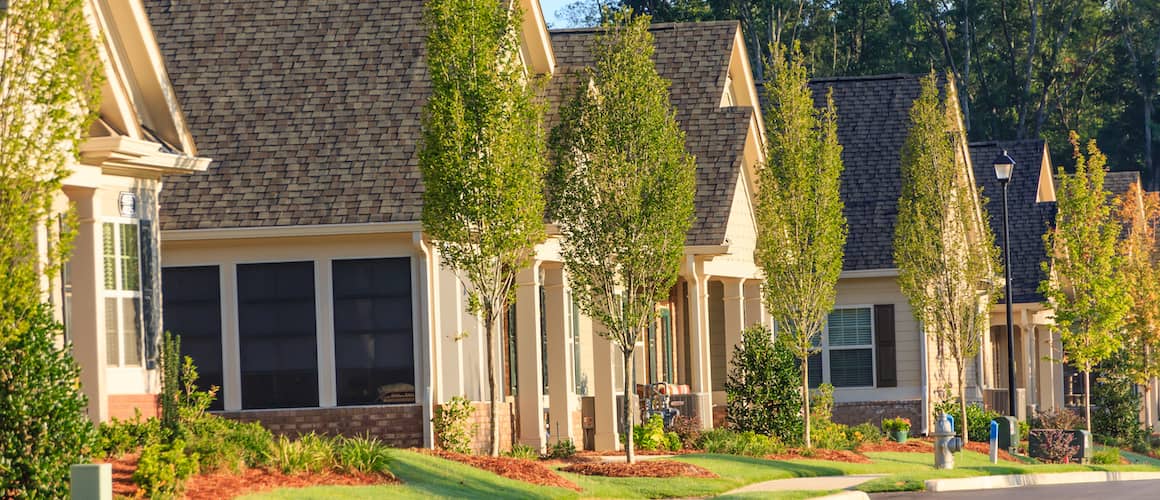 A row of townhouses, representing real estate properties.