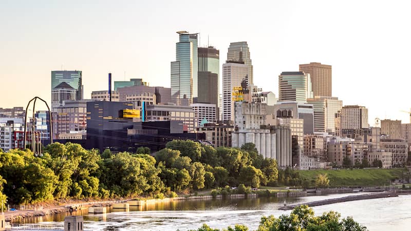 RHB Assets From IGX: Minneapolis skyline with a blue sky and clouds.