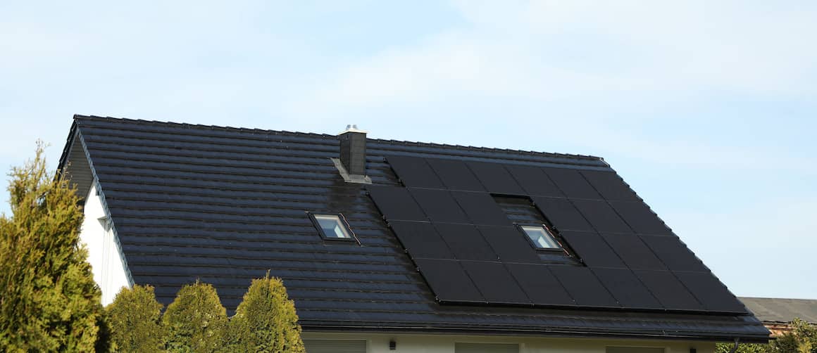 Solar panels on a dark roof.