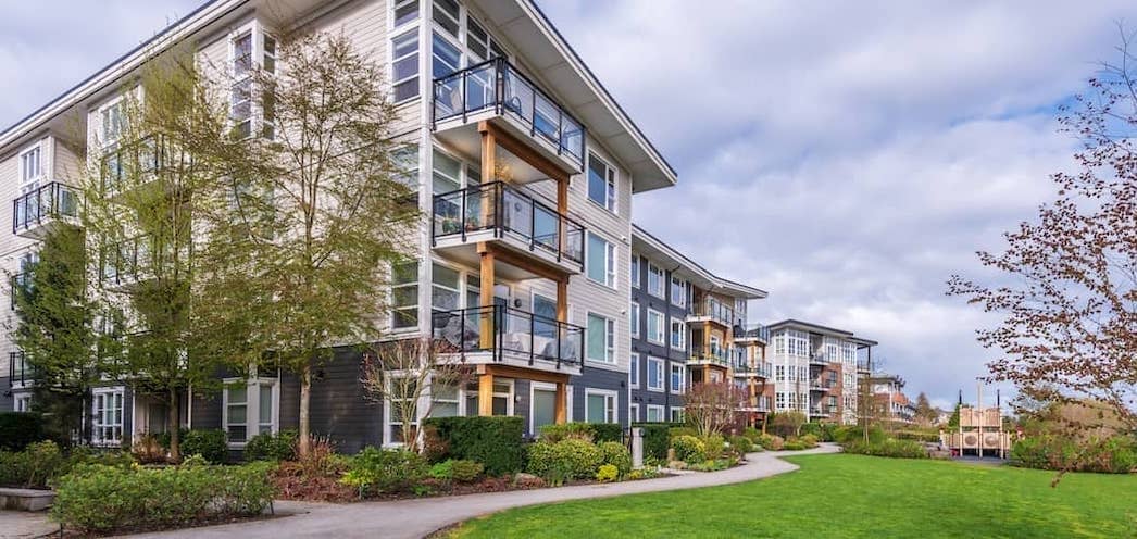 A condo complex with HOA, indicating community living and homeowners' association in real estate.