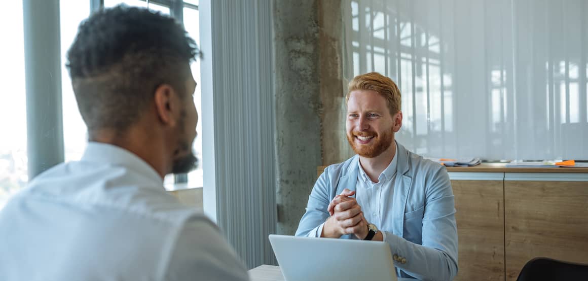 Two people in a casual business meeting.