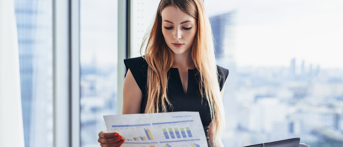 An image suggestive of a woman investing, potentially in real estate or other financial ventures.