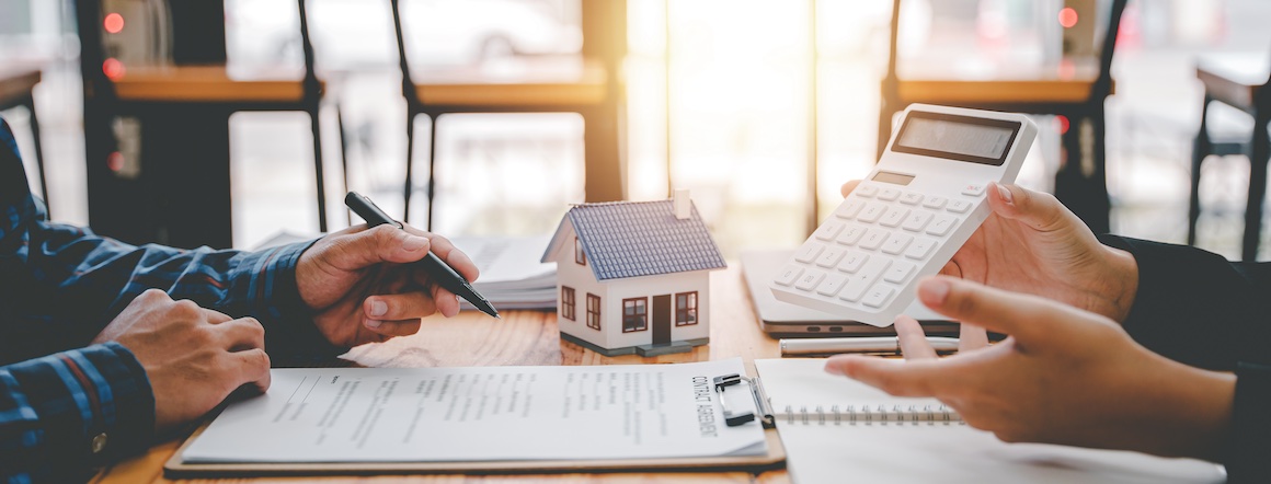 Two individuals discussing a mortgage prequalification.