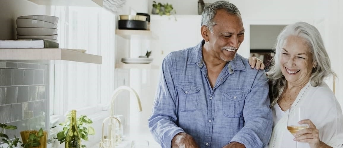 An older couple spending time together, potentially in a home setting.