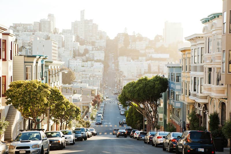 RHB Assets From IGX: San Francisco, California street view with iconic cable cars and architecture.