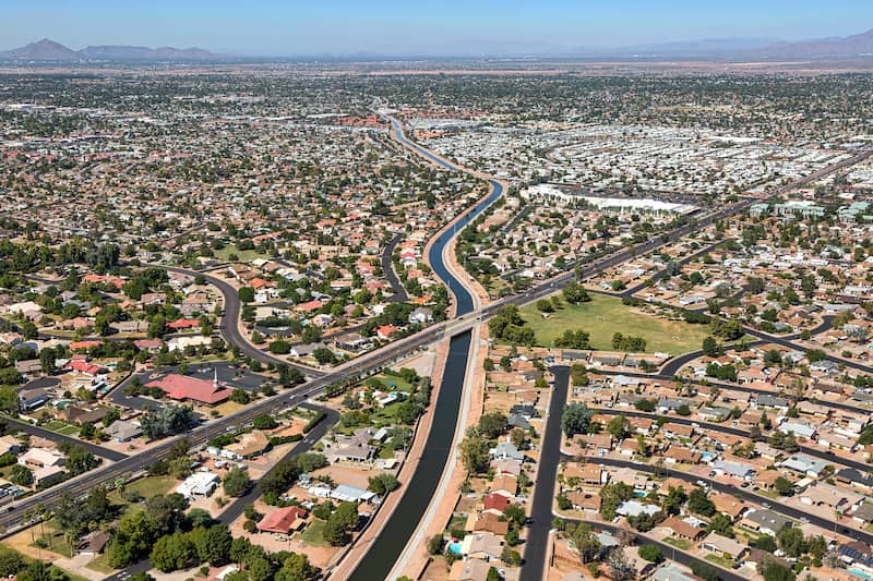 RHB Assets From IGX: Panoramic view of Mesa, Arizona with mountainous landscape in the background.