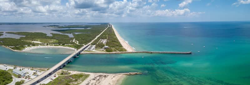 RHB Assets From IGX: Scenic view of Sebastian Inlet with blue skies and calm waters.