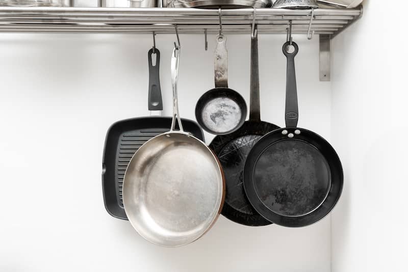 RHB Assets From IGX: Rental kitchen makeover with hanging pots and pans storage solution.