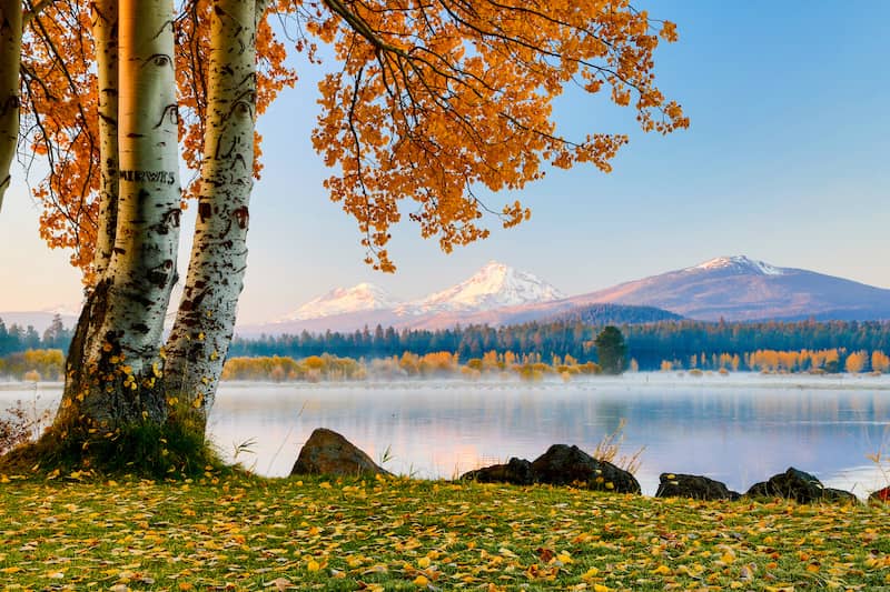 RHB Assets From IGX: Scenic view of Bend, Oregon with mountains and a river in the background.