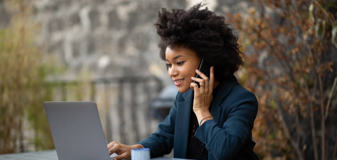 A woman working on a computer, possibly related to remote work, finances, or digital activities.