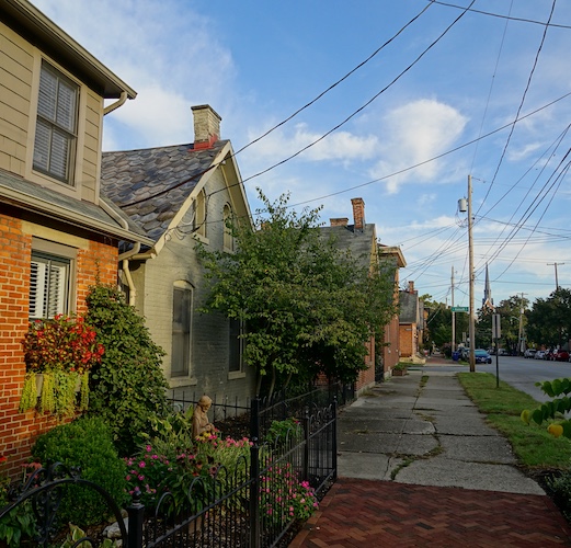 Row of homes along a sidewalk in German Village neighborhood in Ohio.