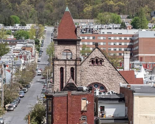 A street lined with cars and buildings in Reading, Pennsylvania.