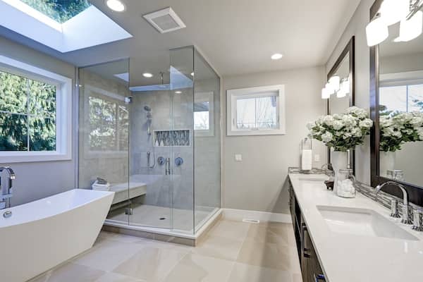 Modern bathroom with large shower and windows.