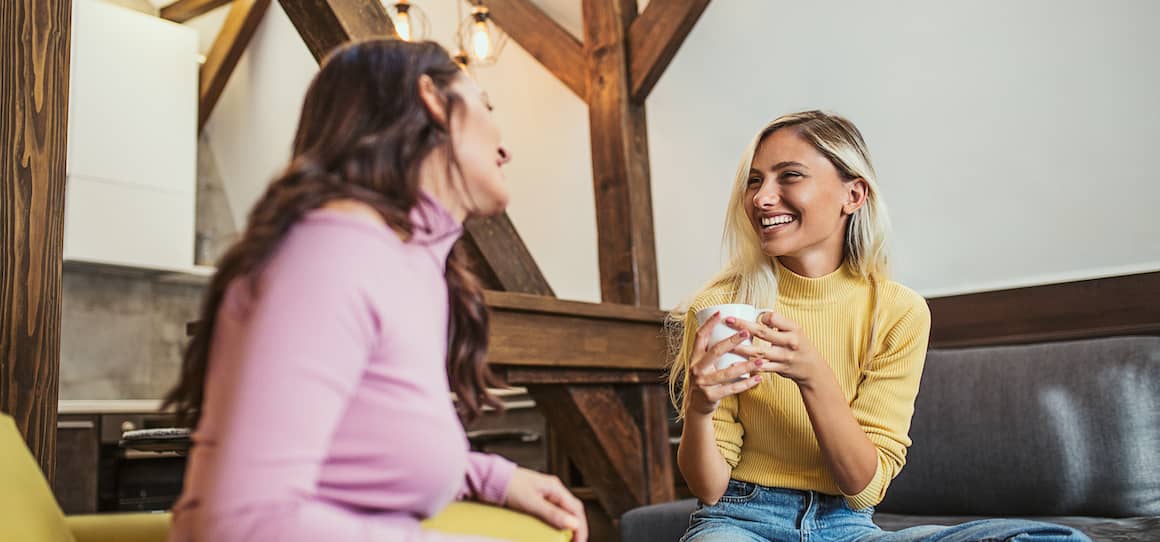 Siblings chatting on the couch, potentially depicting family interactions or discussions related to home or finances.