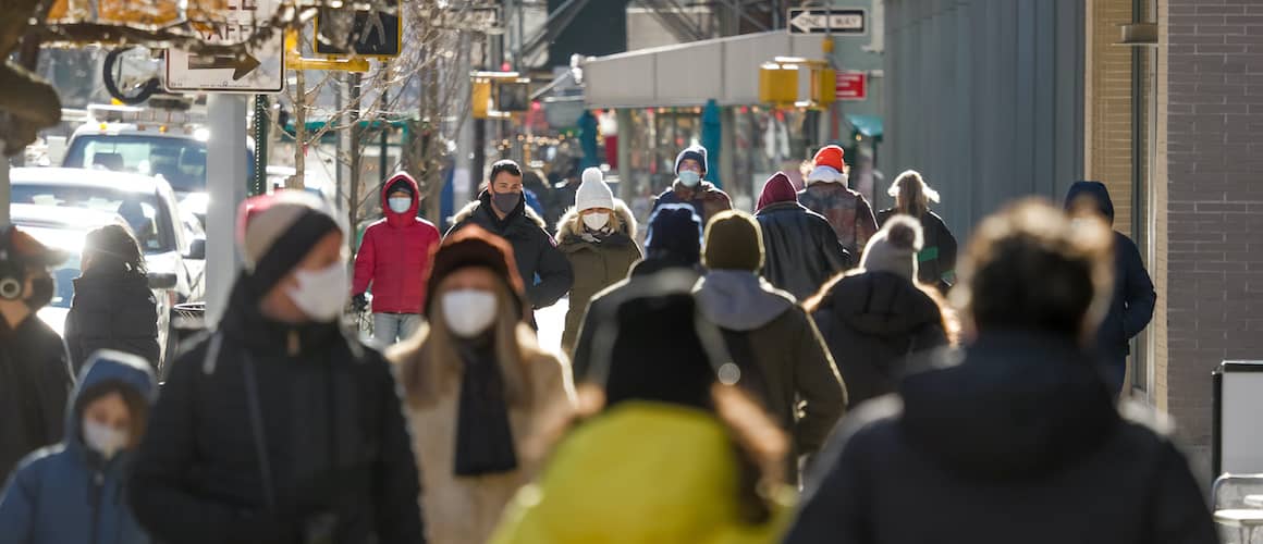 RHB Assets From IGX: A crowd of people wearing protective face masks.