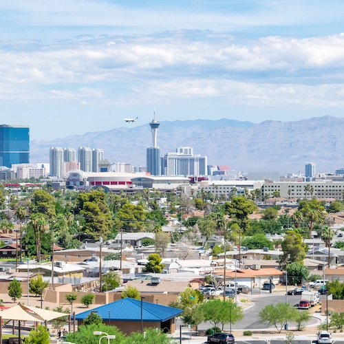 Sunny Las Vegas skyline in Nevada with the mountains behind the city.