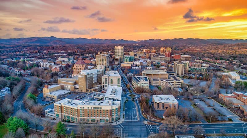 Aerial view of Asheville, North Carolina at sunset.