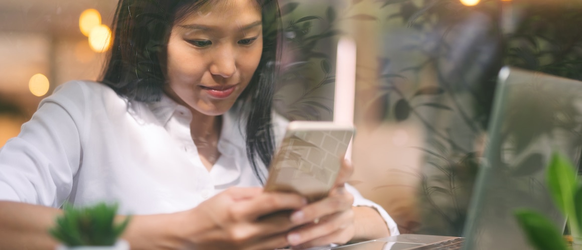 Image of woman automating her loan payments.