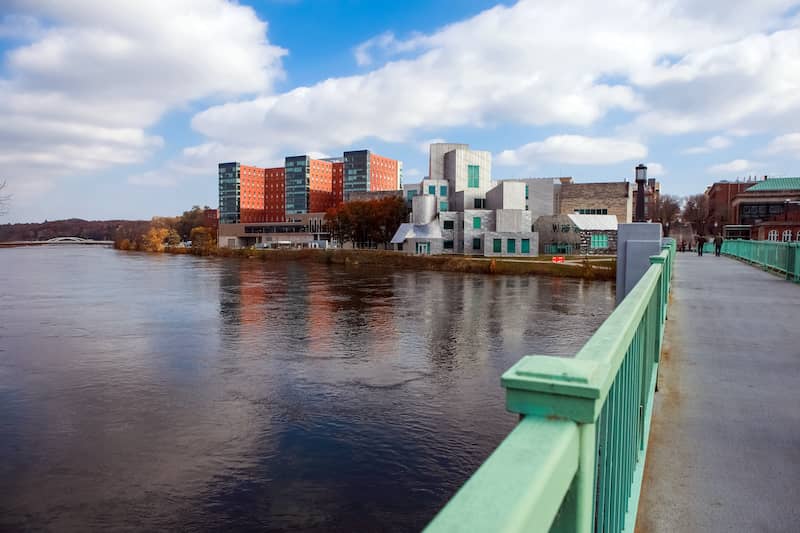 View of Iowa City buildings from bridge over Iowa river.