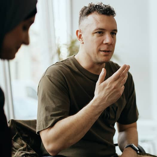 A military man speaking to an advisor, potentially discussing financial aspects or options related to housing.
