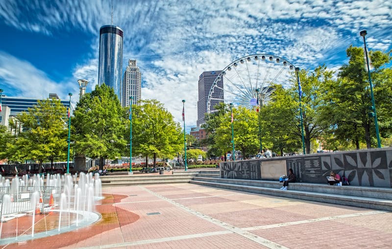 RHB Assets From IGX: Atlanta, Georgia skyline with modern skyscrapers and lush greenery.