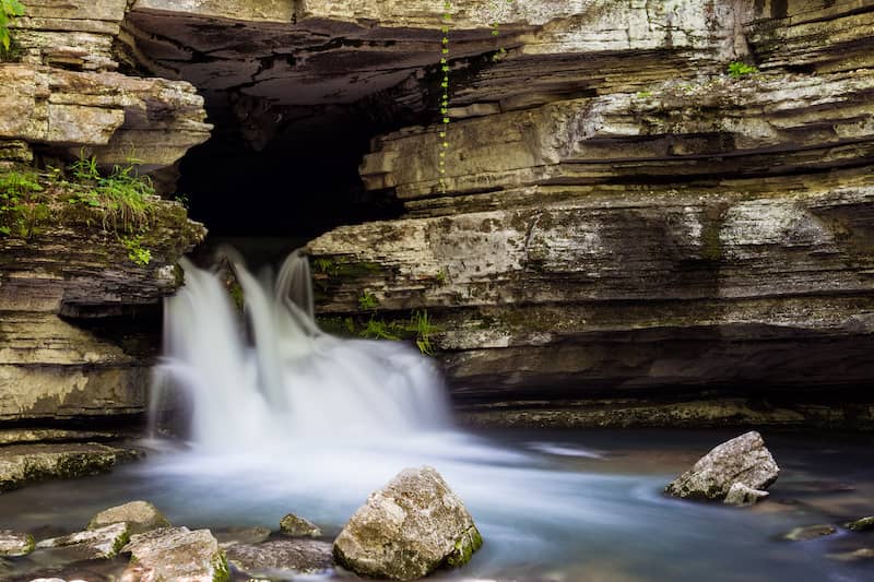 RHB Assets From IGX: Blanchard Springs Waterfall in Arkansas surrounded by lush forest