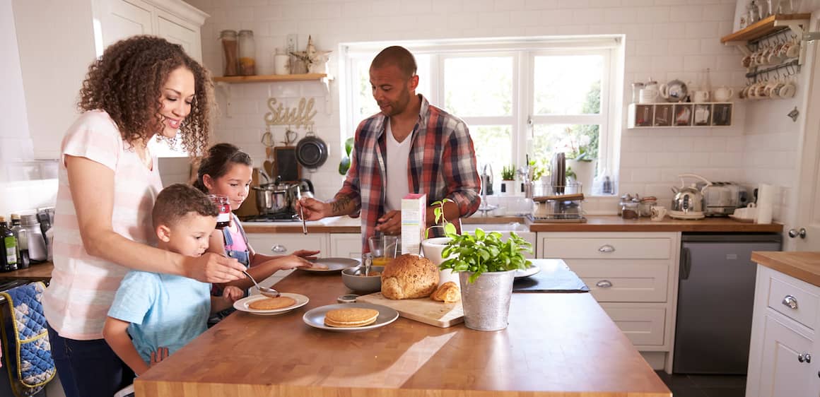 A family making a pancake breakfast together.